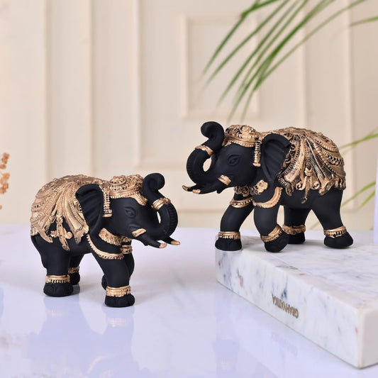 Beautiful Black Golden polyresin Elephant statue set of 2, size 5 inch.