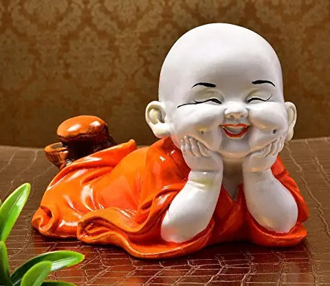 Resting Laughing Baby Buddha Wearing Orange Robe Cute Child Monk Statue Marble Finish Handicrafted Home Office Décor Decorative Showpiece (Polyresin, Orange)